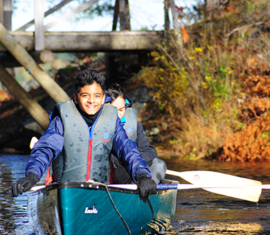 Boys in a canoe