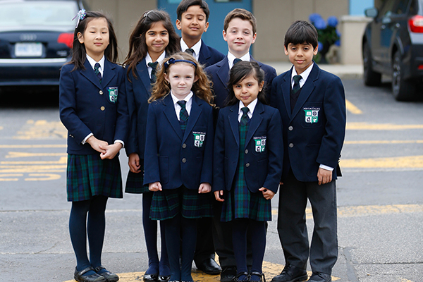 Primary children posing in the parking lot