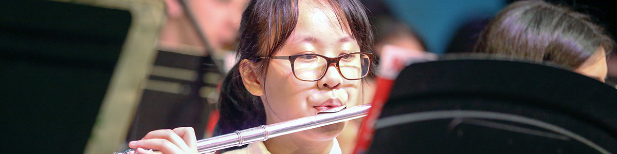 High School student playing flute at the annual Festival of the Arts