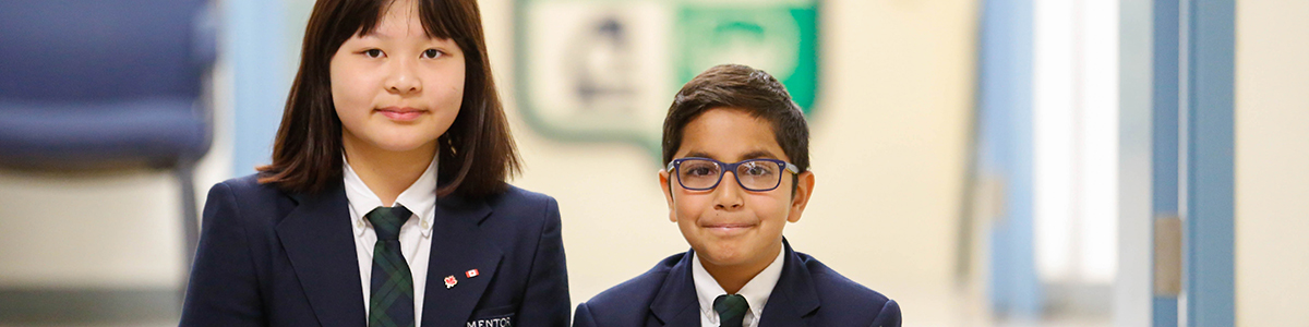 Intermediate children - a boy and a girl - in the upper main hallway