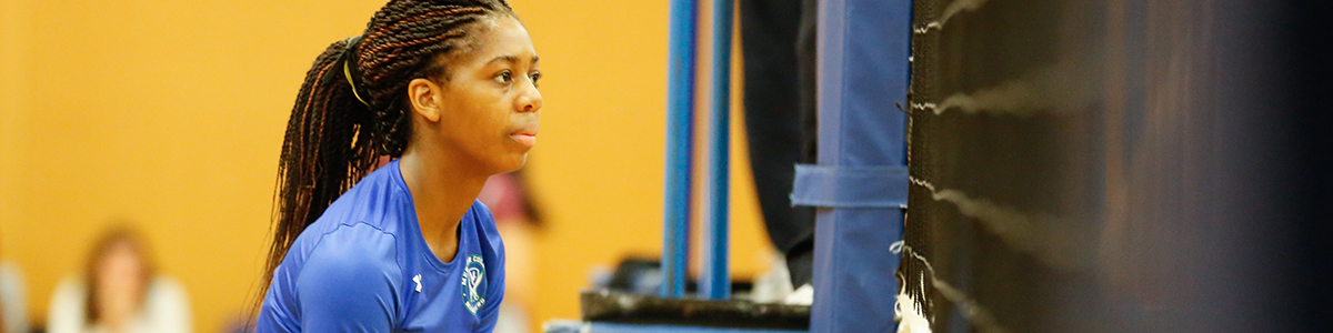 Female High School volleyball player in action