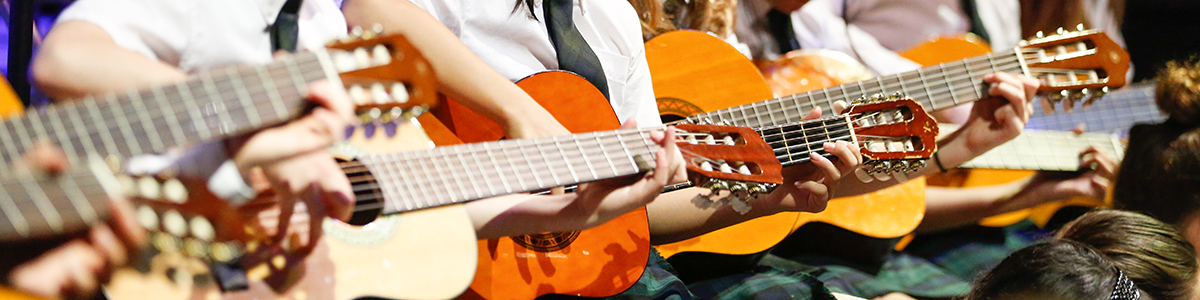 Grade 5 guitar club on stage at annual Festival of the Arts