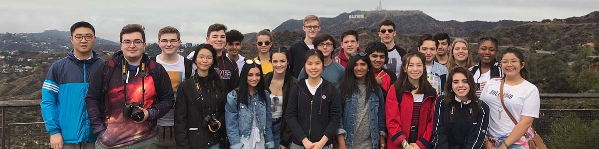 Students in front of "Hollywood" sign